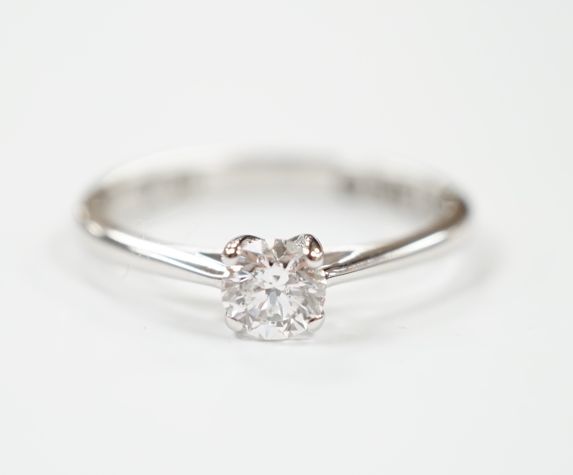 An 18ct white gold and solitaire diamond ring, the stone weighing 0.50ct, size R, gross weight 3.6 grams.